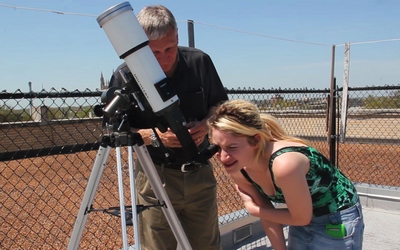 Using a telescope to observe the sky