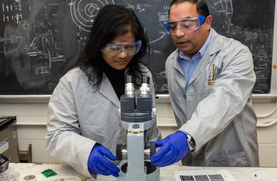 Deepak Singh (right) works with Mizzou graduate student Pousali Ghosh in Singh's lab.
